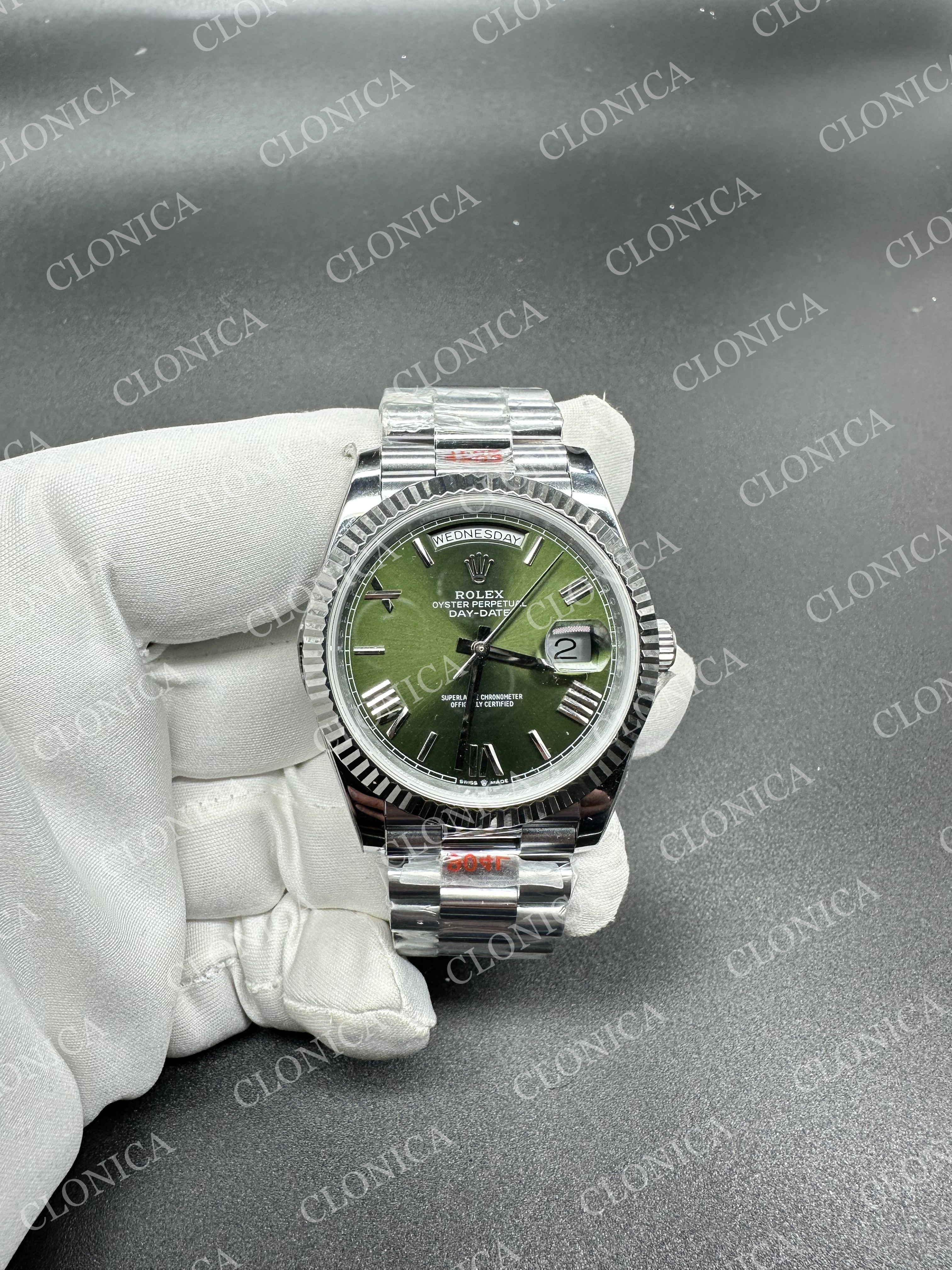 DAY DATE 228239 40MM GAIN WEIGHT GREEN DIAL ROMAN MARKER ON WG PRESIDENT BRACELET